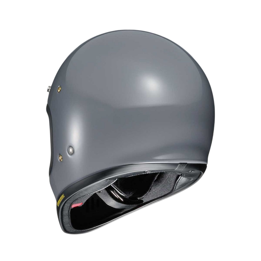 back of grey shoei motorbike helmet with black straps and padding