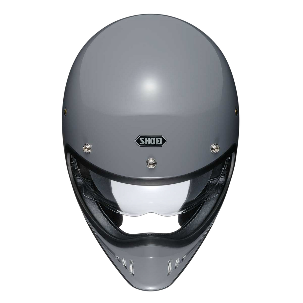 top of grey full face helmet with shoei logo on the front
