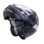 flipped up black and pink motorbike helmet with integrated sun visor