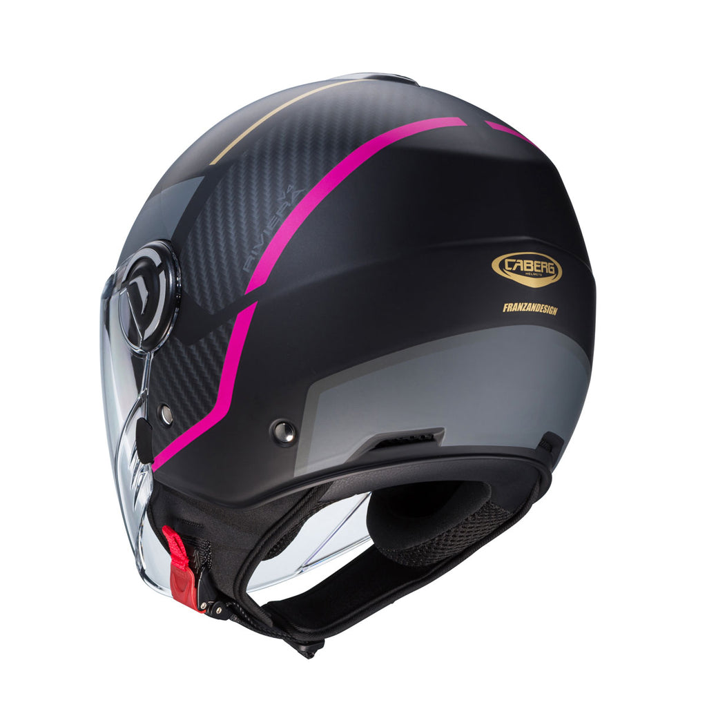 back of black and pink open face helmet with golden caberg logo at the back