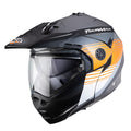 white black and orange off road motorcycle helmet with clear visor, integrated sun visor and peak