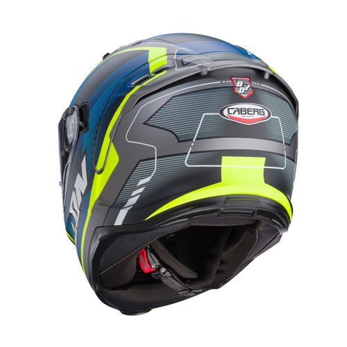 three-quarter view of Caberg Avalon X Optic matt grey blue and yellow showing rear extractors and shell profile